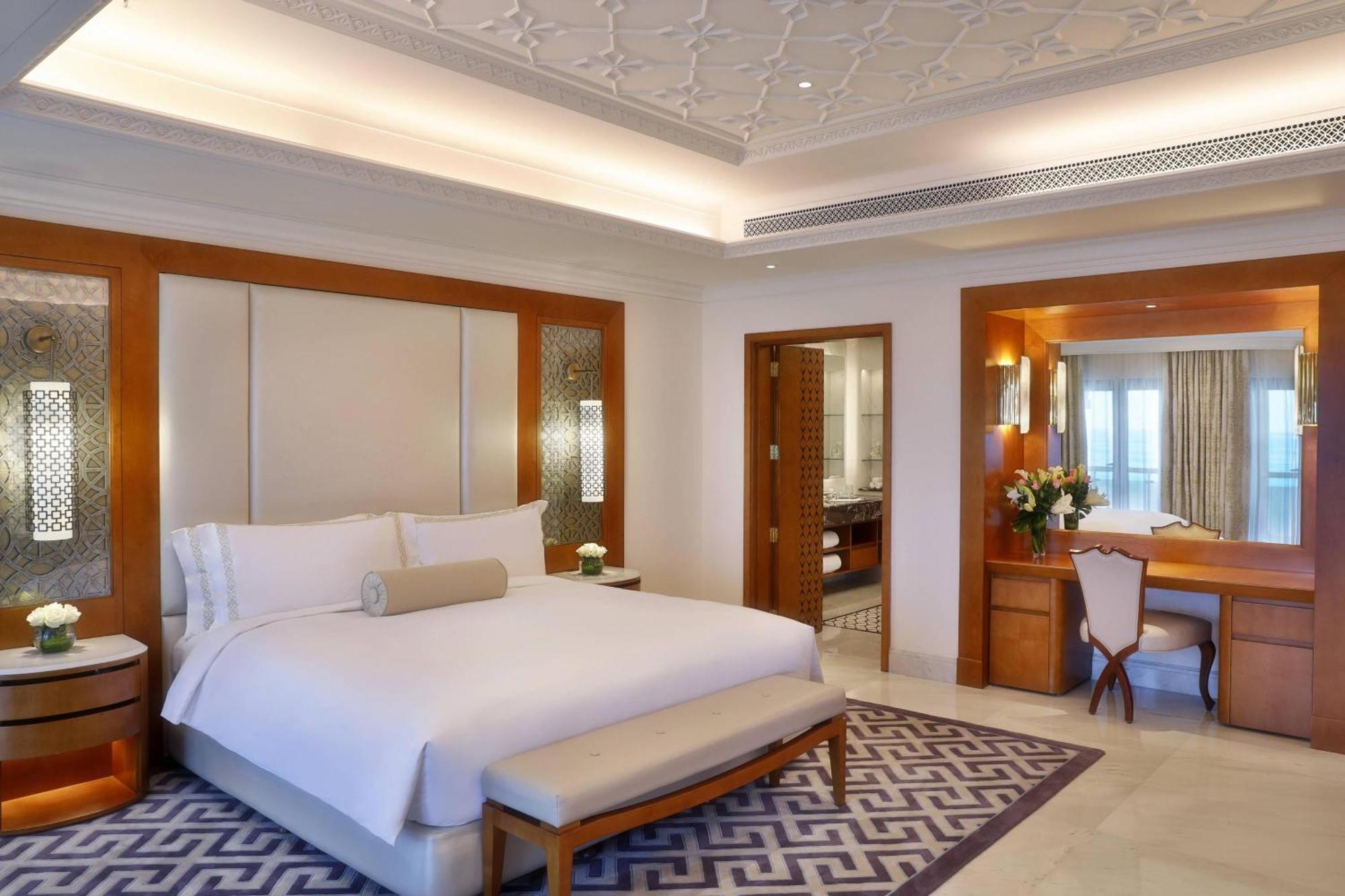 Al Bustan Palace, A Ritz-Carlton Hotel Маскат Екстер'єр фото A bedroom at the Taj Mahal Palace
